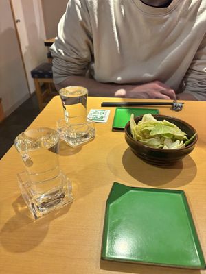 Sake and a sesame cabbage appetiser   at Vegan Izakaya Nowhere in Tokyo