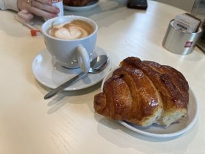 Cappuccino and croissant filled with frutti di bosco jam  at VeganVi in Costigliole Dasti