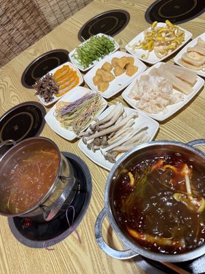 Tomato broth on the left, spicy (ma la) broth on the right. I loved the spicy broth !  at Chongqing Donghua Temple Vegetarian Hot Pot in Chongqing