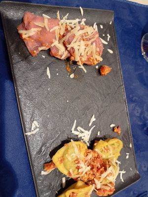 Tortelloni patate e porri e ricotta e spinaci al ragù at Trattoria MODErNA in Montale