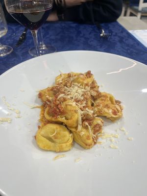 Tortelli di zucca al ragù   at Trattoria MODErNA in Montale