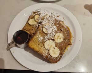 Veganuary special: griddled vegan french toast in our homemade vanilla bouche batter. Topped with Biscoff sauce, crumb, bananas, and Canadian maple syrup at Moose Coffee in Manchester