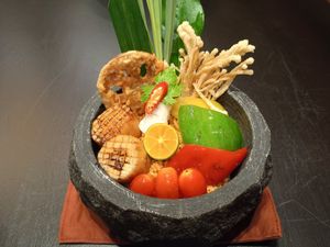 Spicy fried rice with coconut meat, battered enoki mushroom and lotus root. at Vegan Pranakhon in Bangkok