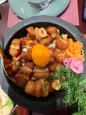 Fried pork belly with egg yolk  at Vegan Pranakhon in Bangkok
