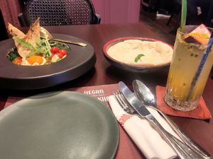 Vegan Shakshuka with pita bread and Sparkling Passion Fruit Drink at Vegan Pranakhon in Bangkok