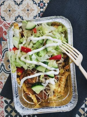 Vegan Kapsalon
Our vegan kapsalon features crispy seasoned vegan meat or seitan, layered over a bed of golden fries, topped with fresh crunchy salad, juicy tomatoes. at Doner Kebab Show in Barcelona