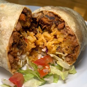 Burrito: choice of Protein (Al Pastor), Four Tortilla, Rice, Beans, Cabbage, Pico de Gallo, Vegan Crema at BZ Taco in Redlands
