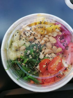 Homemade vegan poke with: white rice, silken tofu, mango, cucumber, pickled onion, pickled ginger, cherry tomatoes, wakame, sesame seeds, caramelized peanuts and basil sauce. at Casa Ramos in Santiago De Compostela