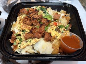 Chorizo bowl with sriracha   at The Broken Yolk Cafe  in Irvine