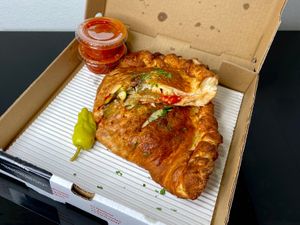BYO calzone w/eggplant + zucchini + roasted garlic (cut in half for pic) at Modena Pizza & Pasta in Seattle