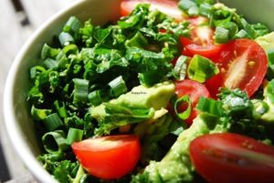 One of the Farm to Table items, Happy Kale salad with Avo. Sesame oil and lime dressing.  at Naked Sprout Juice Bar Cafe in Whistler