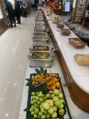 Fruits and stir fry veggies   at Shanbenzhai Vegetarian Cafeteria in Qujing