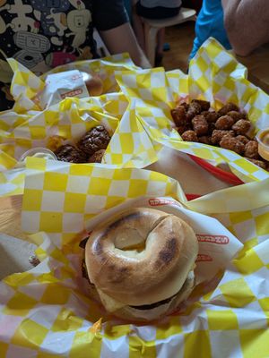 Fully loaded bagel and tots at Shahar in Louisville