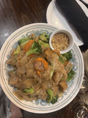 Vegetable pad see ew (specify no egg or oyster sauce) with tofu and crushed peanuts!  at Thai Smile Cuisine in Hilton Head Island