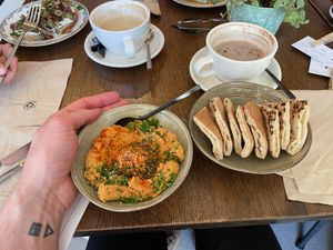 Dry tomatoes hummus with pita bread CHF 11.00 (vegan) at Apotheca Cafe - Brunch - Bar in Neuchatel