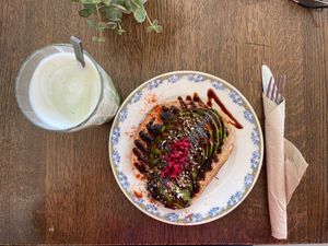 Avocado toast (without egg), sourdough bread, lime, pomegranate, hemp/poppy seeds, and balsamic cream. CHF 11.- (vegan)   at Apotheca Cafe - Brunch - Bar in Neuchatel