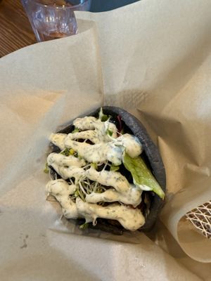 Falafel on house made hemp charcoal pita with tzatziki sauce. at Yaam in Yokosuka