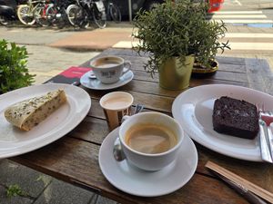 Banana cake, chocolate cake, americanos at Chimney Cake Bakery & Cafe  in Amsterdam