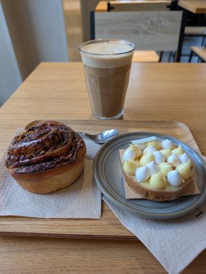 Citrus tart, babka roll and cafe latte at Land & Monkeys - Les Halles in Paris