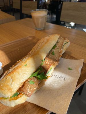 Banh mi and decaf cappuccino   at Land & Monkeys - Les Halles in Paris