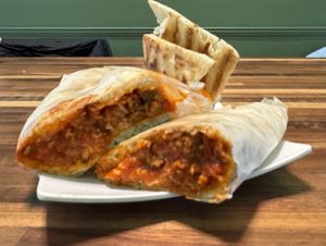 Vegan Meatball Wrap with side of Baba ghanoush and pita chips.   at Adam and Eve Cafe in Birmingham