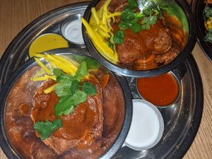 2 orders of wings with 2 sides of yogurt sauce and two hot sauces. Green was sweet and spicy and red was a bit hotter. at The Sudra - 28th Ave in Portland