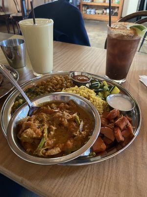 Curry Thali with Soy curls (center), Tamarind Limeade (left), and Mango Lassi (right)  at The Sudra - 28th Ave in Portland