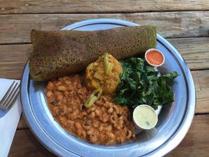 Kale infused dosa plate: Kale Infused Dosa, Black Eyed Pea Korma, Potato Masala, Collards, Pickled Anaheim Chiles, Cilantro-Lemon Sauce, Roasted Red Pepper-Cashew Chutney at The Sudra - 28th Ave in Portland