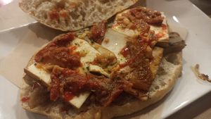 Bocadillo de tofu, babaganoush de berenjena con "picaeta de cacaus" y siracha. at Tomatito in Valencia