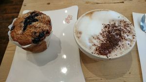 soy cappuccino and blueberry muffin at Le Pain Quotidien - Varenne in Paris