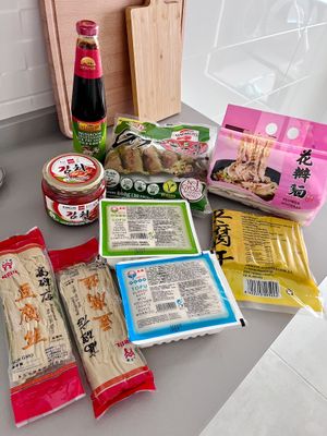 My first purchases in Alimentación Oriental store: four types of tofu, vegan kimchi, noodles, mushroom and soy sauce, vegan gyoza at Alimentación Oriental in Lugones