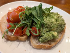 Avocado and roasted tomatoes on sourdough at Slattery in Manchester