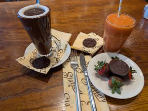 Hot chocolate, fruit smoothie and chocolate dipped strawberries. at Slattery in Manchester