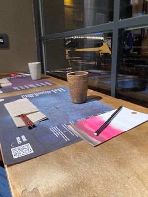 The table towards the window, instructions for having your ramen, card and pencil to make your wishes  at Yume Ramen in Rimini