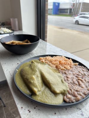 Tamales, fries behind, enchiladas with onions at the back.  at Abuelita Coco in Oak Lawn