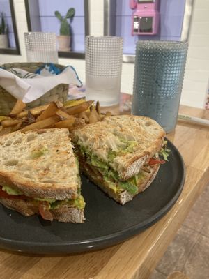 Mushroom sandwich with fries • Cielito Lindo smoothie (pineapple and blue spirulina flavor)  at Abuelita Coco in Oak Lawn