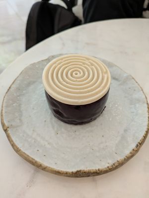 Blueberry mousse, financier, and chocolate filling at Benevola in Barcelona
