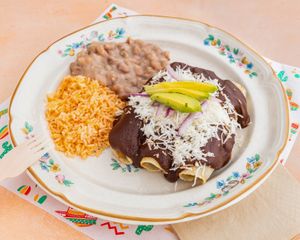 MOLE ENCHILADAS
Rolled corn or flour tortillas filled with shredded seitan beef or GF soy chicken, smothered in velvety mole sauce, sour cream, melted mozzarella, red onion, and at El Nopalito Vegan Taqueria - Food Stall in Fort Lauderdale