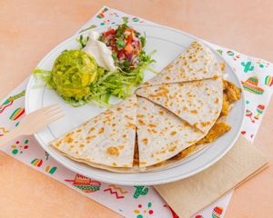 PROTEIN QUESADILLA
Choose flour tortilla or handmade corn tortillas, packed with mozzarella cheese and your choice of meat substitute. Served with lettuce, pico de gallo, guac & S at El Nopalito Vegan Taqueria - Food Stall in Fort Lauderdale