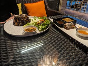 Spring roll with sweet chili dip (mild) and red curry satay dip (hot!) and red bean rice tofu at 3 Monkeys in Hua Hin