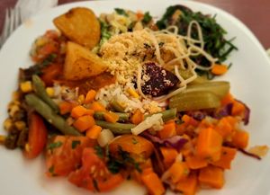 Different dishes on one plate at Escola Senac Pelourinho in Salvador