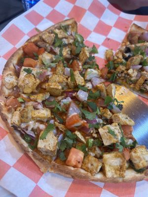 Butter chickun pizza (without cheese) but vegan cheese is available.  You can also specify your spice level.  at Pizza Twist in Chesapeake