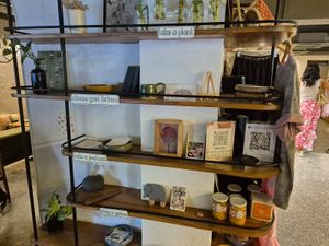 Cute stand with postcards, plants etc at Greenr Cafe in Mumbai