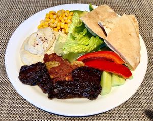 Hummus, muhammra, salad and bread  at Taybeh Restaurant in Aqaba