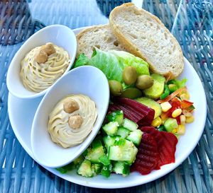 Hummus, salad and bread  at East & Seaboard  in Dubai