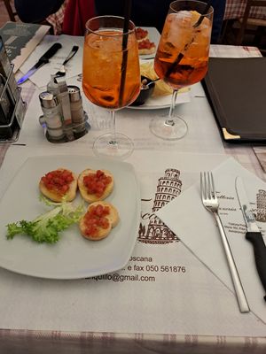 Aperol spritz with broschetta and chips at Trattoria Toscana dal 1976 Pisa in Pisa