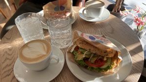 Oat cappuccinos and avocado-tomato bagels.  at Campus Suite  in Hamburg