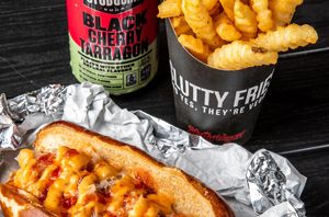 #BigDawg! Vegan Bratwurst, sauerkraut, Chili & Slut sauce! at Slutty Vegan in Baltimore