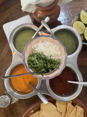 4 salsas, onions, cilantro and lime as toppings for tacos   at Tacos Sonorita Olas Atlas in Puerto Vallarta