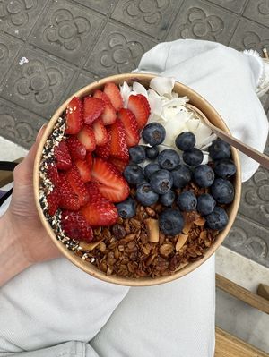 Açai bowl with fruit, granola, coconut flakes and peanut butter💗 at GAIA's GARDEN in Barcelona